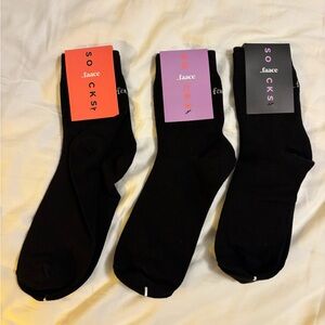 160 pairs of black socks that say Dirty, Sweaty or Tired